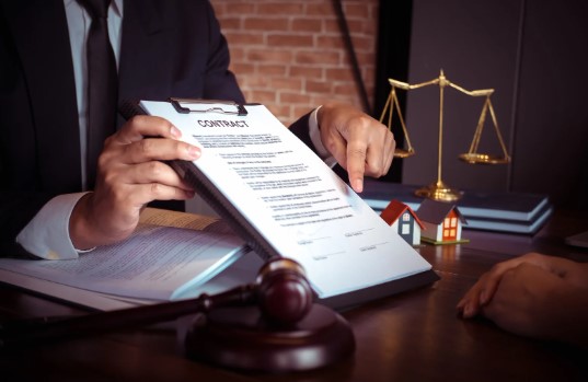Lawyer presenting a contract document with gavel, scales of justice, and books on desk, symbolizing share purchase agreements.
