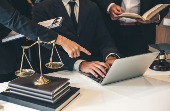 Legal team working on franchise documents with a Toronto-based franchise lawyer at Cloudhaus Law.