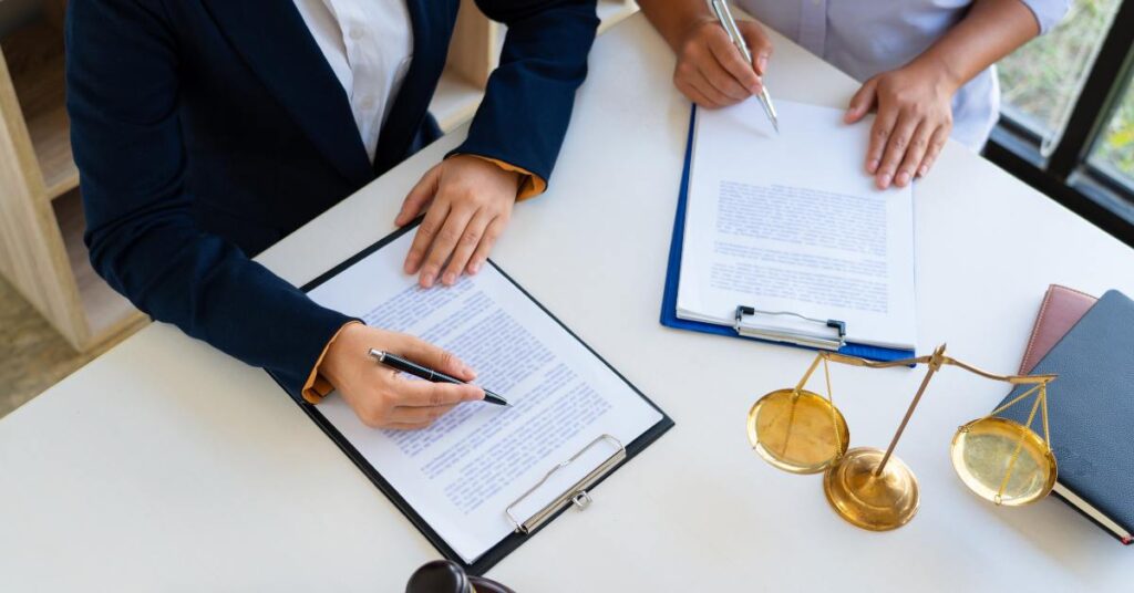 Franchise lawyer in Toronto drafting and reviewing FDD documents at a law office.