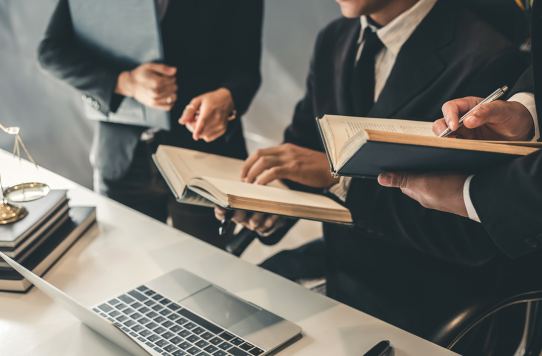 Franchise legal team reviewing documents during a client consultation in Toronto.