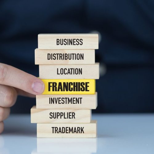 Franchise written on a wood with yellow color