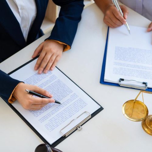 Franchise lawyer in Toronto drafting and reviewing FDD documents at a law office.